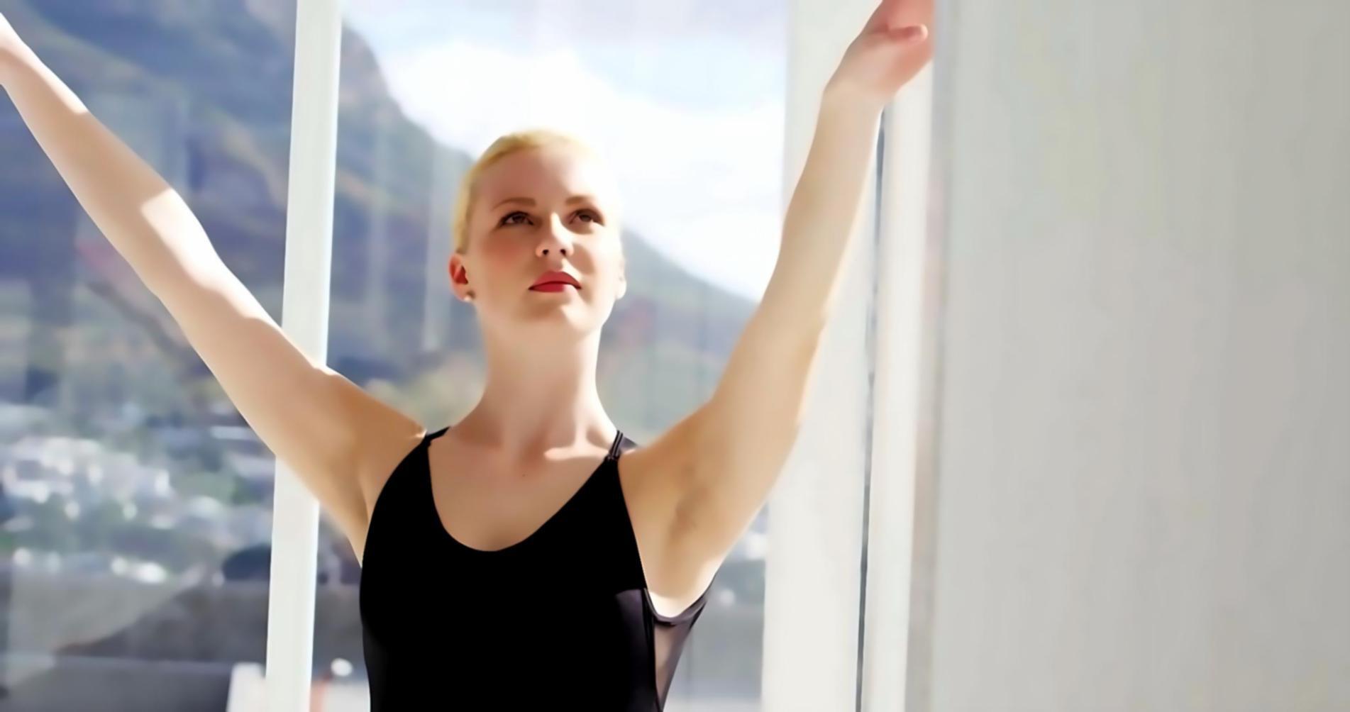 Instructor teaching dance movement fundamentals